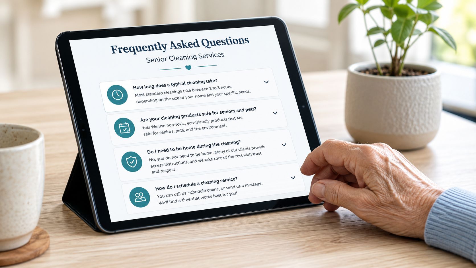 An elderly person uses a tablet to view cleaning services frequently asked questions in a brightly lit room.